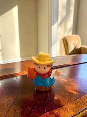 Fisher-Price Little People Farmer Jed Action Figure Holding Sack of Feed